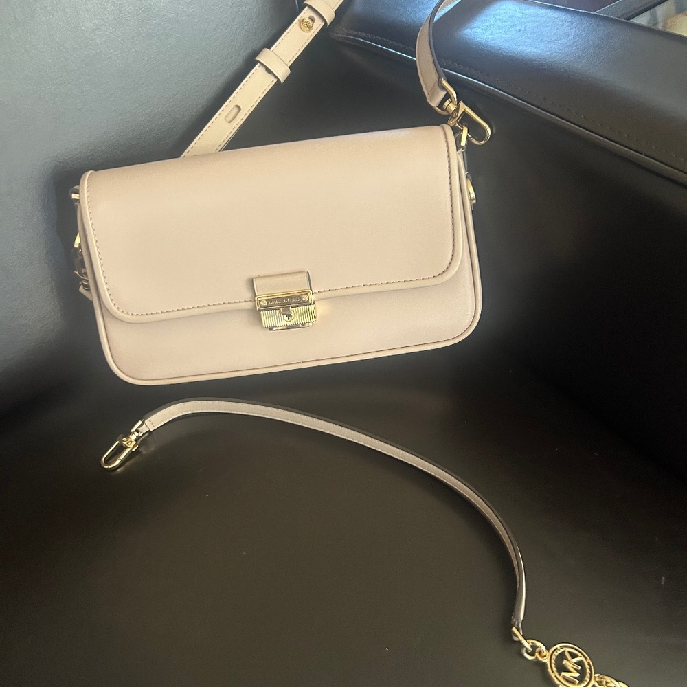Michael Kors small pink bag with shoulder strap or short handheld strap